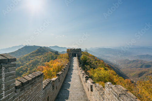 China The great wall distant view compressed towers and wall segments autumn season in mountains near Beijing ancient chinese fortification military landmark in Beijing, China.