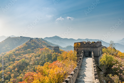 China The great wall distant view compressed towers and wall segments autumn season in mountains near Beijing ancient chinese fortification military landmark in Beijing, China. photo