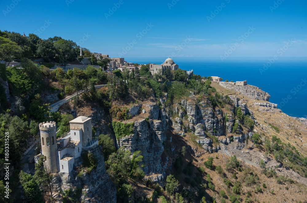 Panoramic view to Tyrrhenian coastline with the Church of Saint John the Baptist and Torretta Pepoli - little castle in Erice, Sicily, Italy