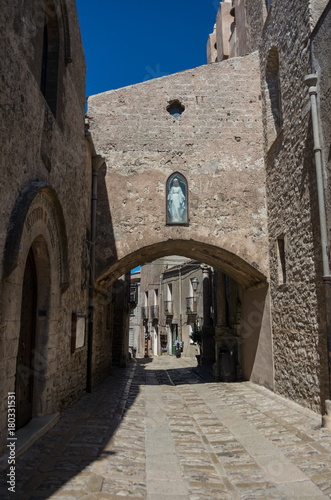 Fototapeta Naklejka Na Ścianę i Meble -  Narrow ancient cobblestone street of medieval town Erice, Sicily, Italy