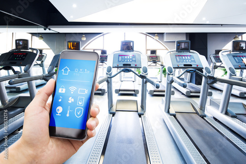 smart phone with smart home with modern gym photo