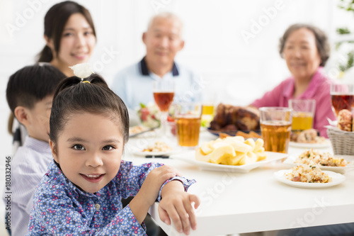 happy asian family having dinner  at home
