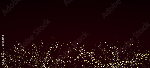 Abstract shiny golden splashes of waves on dark background. Explosions of confetti or champagne.