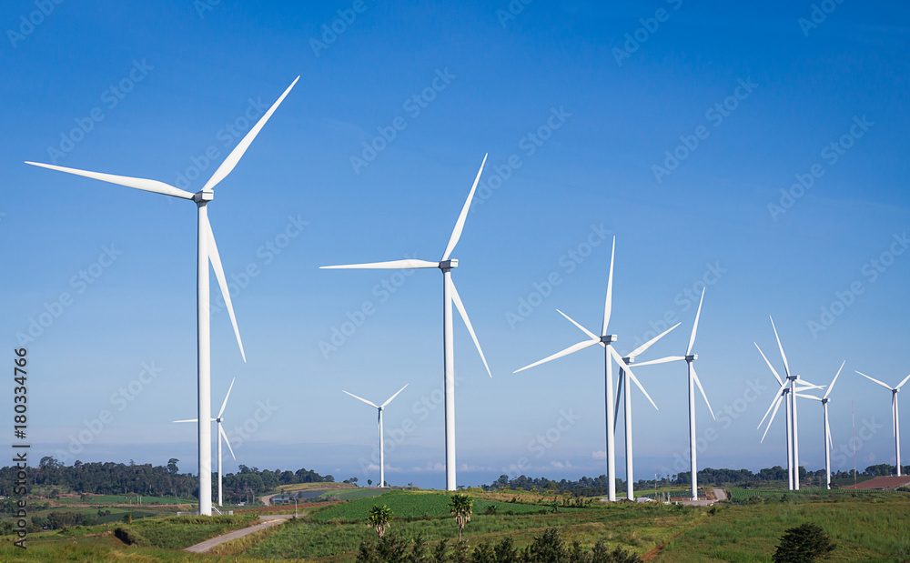 Turbines are rotating to produce electricity, photos with skies, mountains and trees are components. Turbines are rotating to produce electricity, photos with skies, mountains and trees are components.