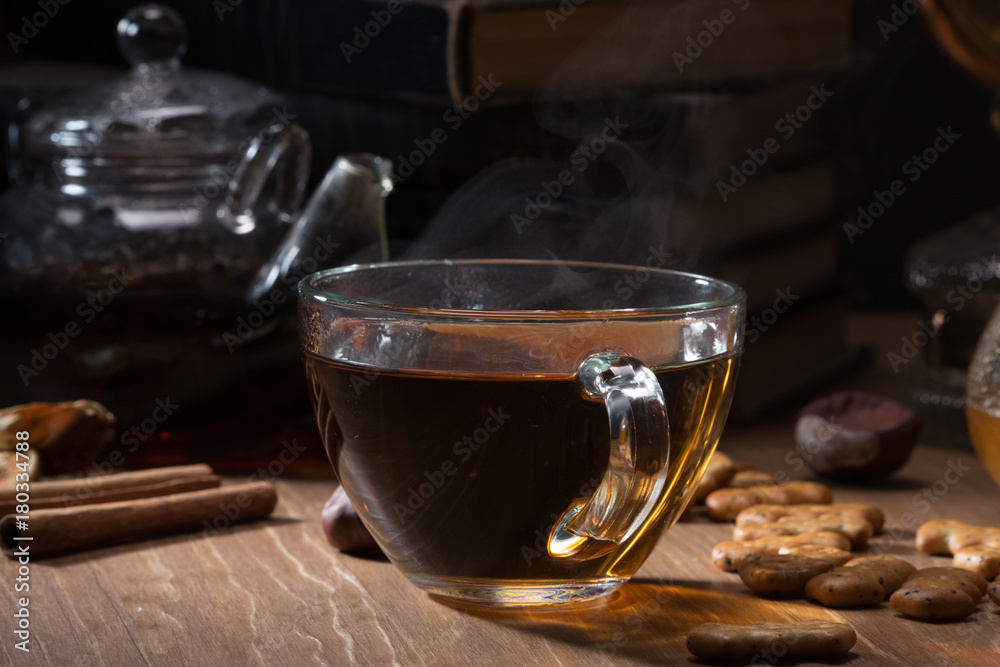 Cup with tea and teapot Cup with tea and teapot