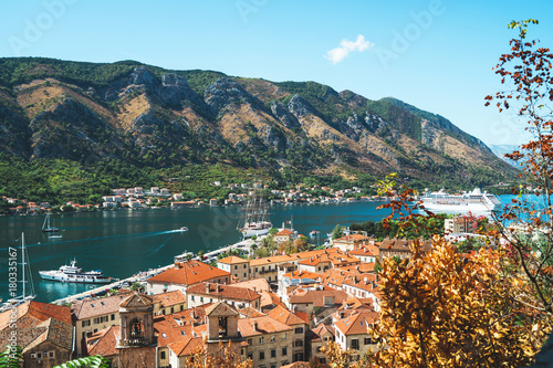 Top view of beautiful european town and ship arriving in the port