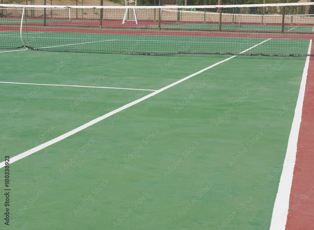Closeup of outdoor clay tennis court with net