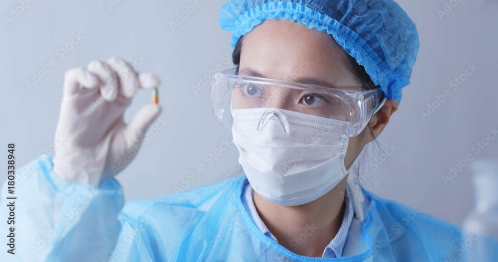 Scientist holding a medicine Scientist holding a medicine