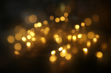 abstract bokeh background of golden light burst made from bokeh motion