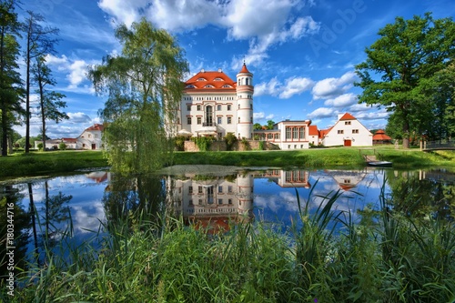 Neo-Gothic style palace surrounded by an English landscape garden in Wojanow, Poland