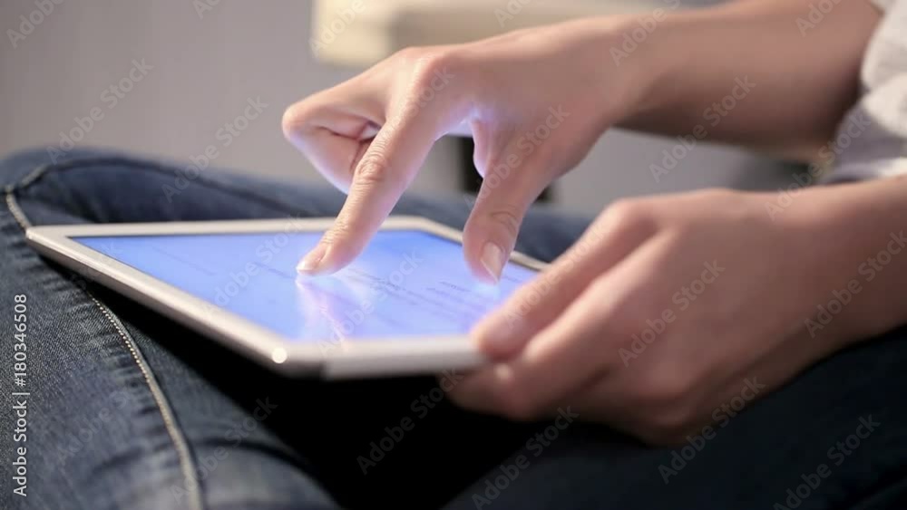 Hand touching digital tablet computer surface touchscreen. Hand touching digital tablet computer surface touchscreen.