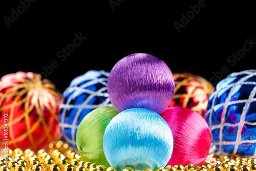 Colored christmas balls on dark background