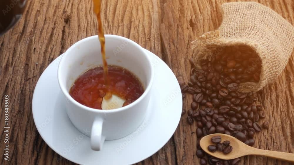 Slow Motion : Pouring coffee in to coffee cup. Slow Motion : Pouring coffee in to coffee cup.
