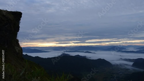 Phu Chi Fa forest park and mountain at sunrise with sea of fog in morning, Landmark of Chiang Rai, Thailand, Time lapse video footage