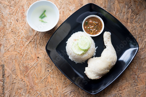 Hainanese chicken rice with soup and sauce, top view