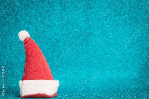 Santa Claus red hat on sparkling background.  Christmas seasons celebration concept