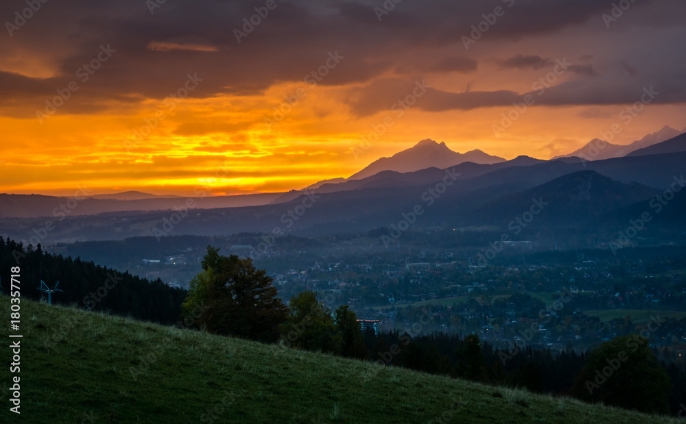 Dawn over peak Havran and Zakopane in Tatra mountains from Koscielisko, Poland Dawn over peak Havran and Zakopane in Tatra mountains from Koscielisko, Poland