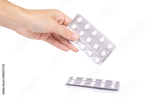 Medicine in tablet package in hand isolated on white background, pills in blister