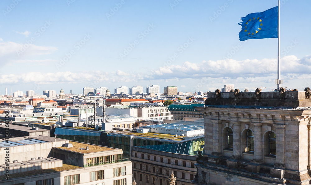 Berlin city and EU flag over Reichstag Palace