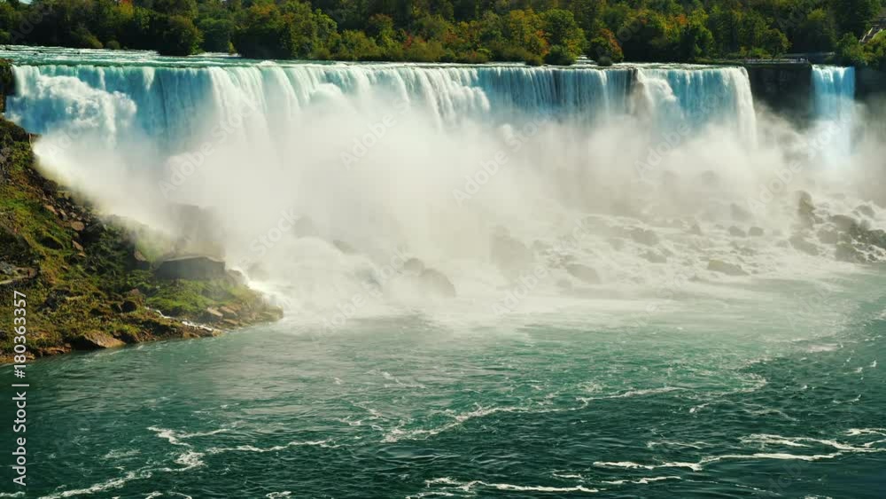 Cascade of incredible waterfalls - Niagara Falls. View from the Canadian side to the American coast