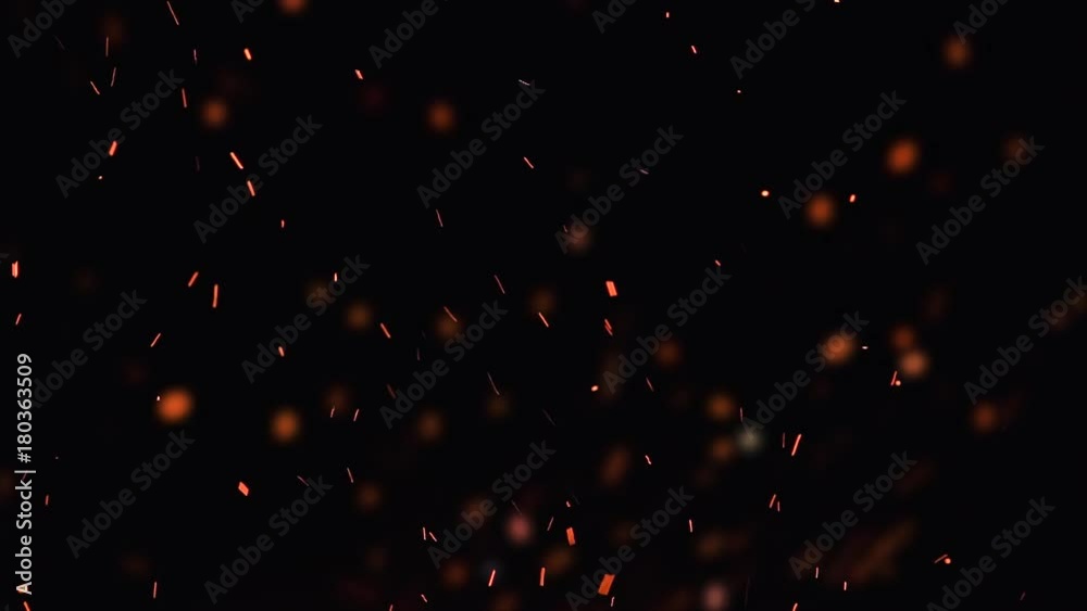ultra slow motion high speed shot of fire flames and glowing ashes on black background