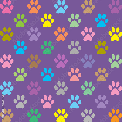 Colorful puppy paws pattern on purple background
