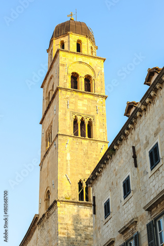 The bell tower of the Franciscan church and monastery in the main city street Stradun in Dubrovnik, Croatia.