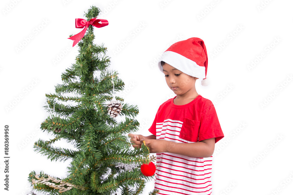 Cute little boy with decorating Christmas tree Cute little boy with decorating Christmas tree