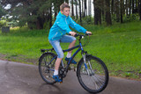 teen rides a bicycle