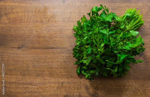 Fresh parsley on a wooden background. with copy space. top view
