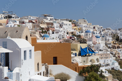 Landscape panorama with white houses and ancient wind mill in the Santorini, Oia, Greece