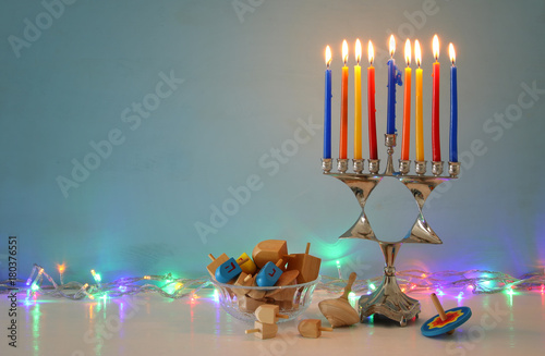 image of jewish holiday Hanukkah background with menorah (traditional candelabra) and candles.
