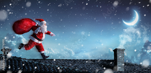 Santa Claus Running On The Rooftops   © Romolo Tavani