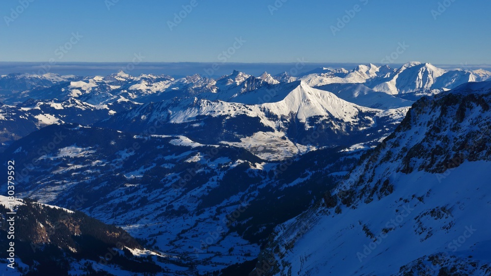 Winter scene in Switzerland. View from the Diablerets glacier. Sunlit mount Lauenenhorn.
