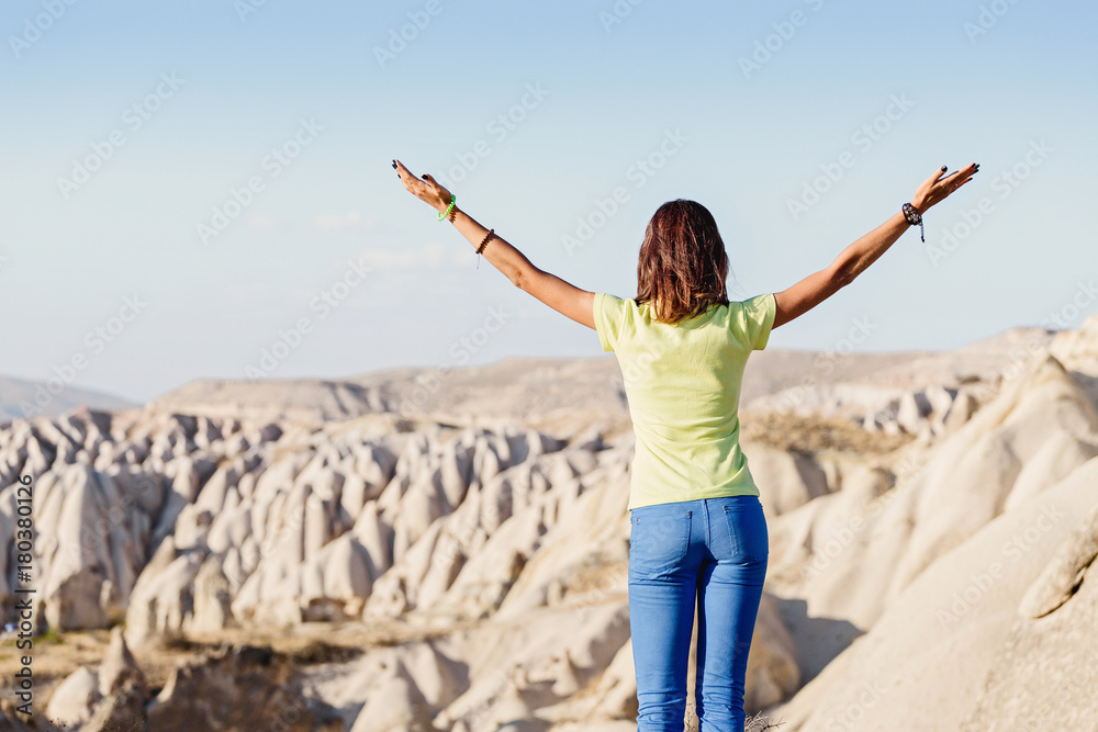 Young happy tourist woman travel at Cappadocia, Turkey. Young happy tourist woman travel at Cappadocia, Turkey.