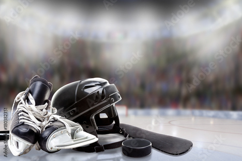 Canvas Print Ice Hockey Helmet, Skates, Stick and Puck in Rink