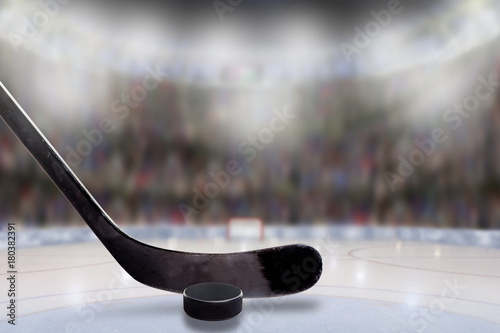 Ice Hockey Stick and Puck in Rink With Copy Space