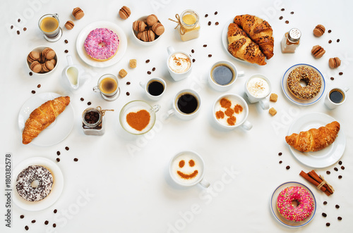 White background with different types of coffee and desserts to them © nata_vkusidey