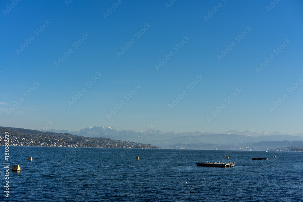 lake zurich water view with gold coast in the back and mountains