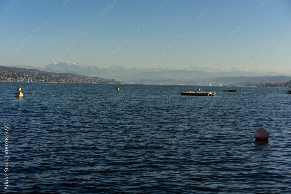 lake zurich water view with gold coast in the back and mountains