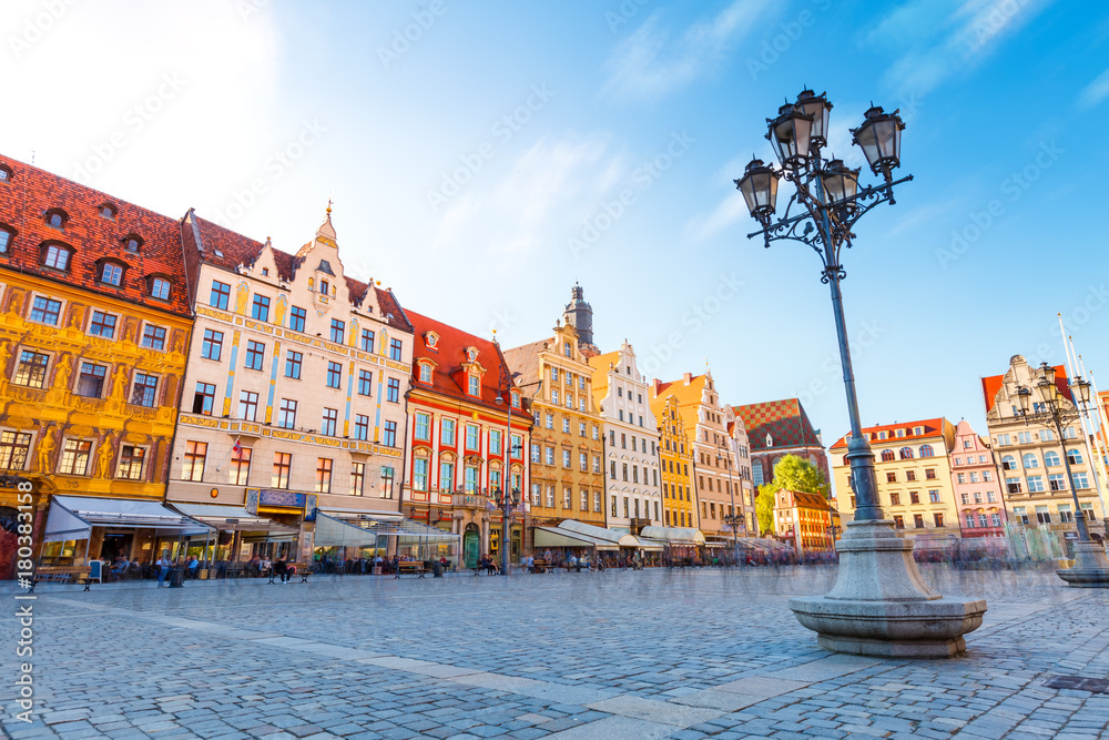 Naklejka premium Fantastic view of the ancient homes on a sunny day. Location famous Market Square in Wroclaw, Poland, Europe. Historical capital of Silesia. Beauty world.