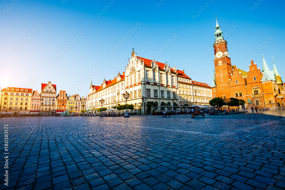 Fototapeta premium Fantastic view of the ancient homes on a sunny day. Location famous Market Square in Wroclaw, Poland, Europe. Historical capital of Silesia. Beauty world.