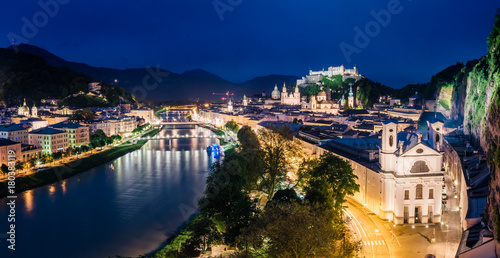 Great  view from the top on an evening city shining in the lights. Location famous place (unesco heritage) Festung Hohensalzburg, Salzburger Land, Austria Europe. Beauty world. © Leonid Tit