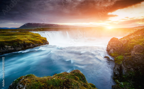 The rapid flow of water powerful Godafoss cascade. Location place Skjalfandafljot river, Iceland, Europe.