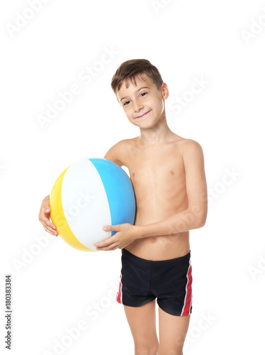 Cute little boy with beach ball on white background