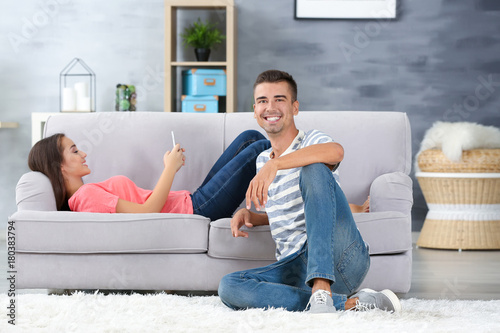 Young couple at home together