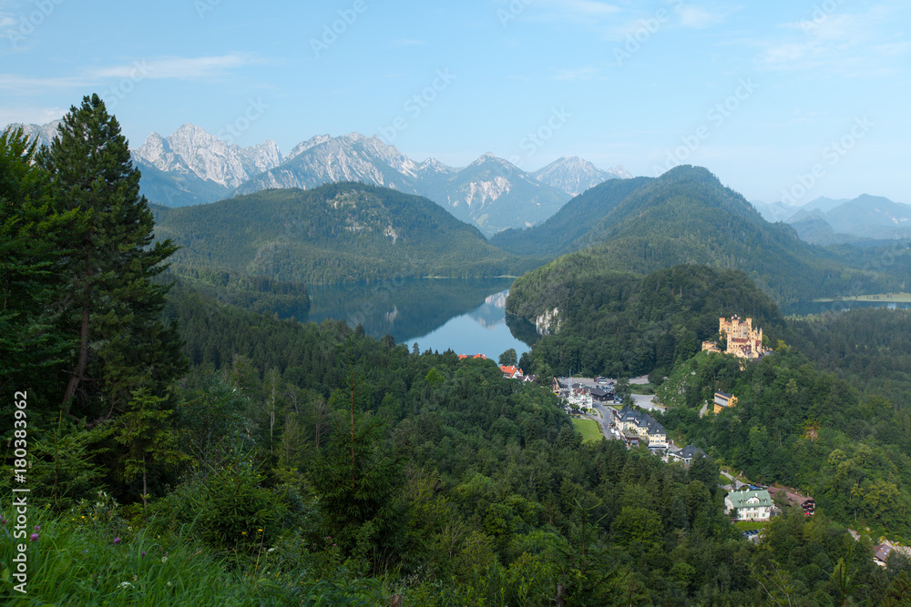 Castle Schwangau with green pine forest and lake