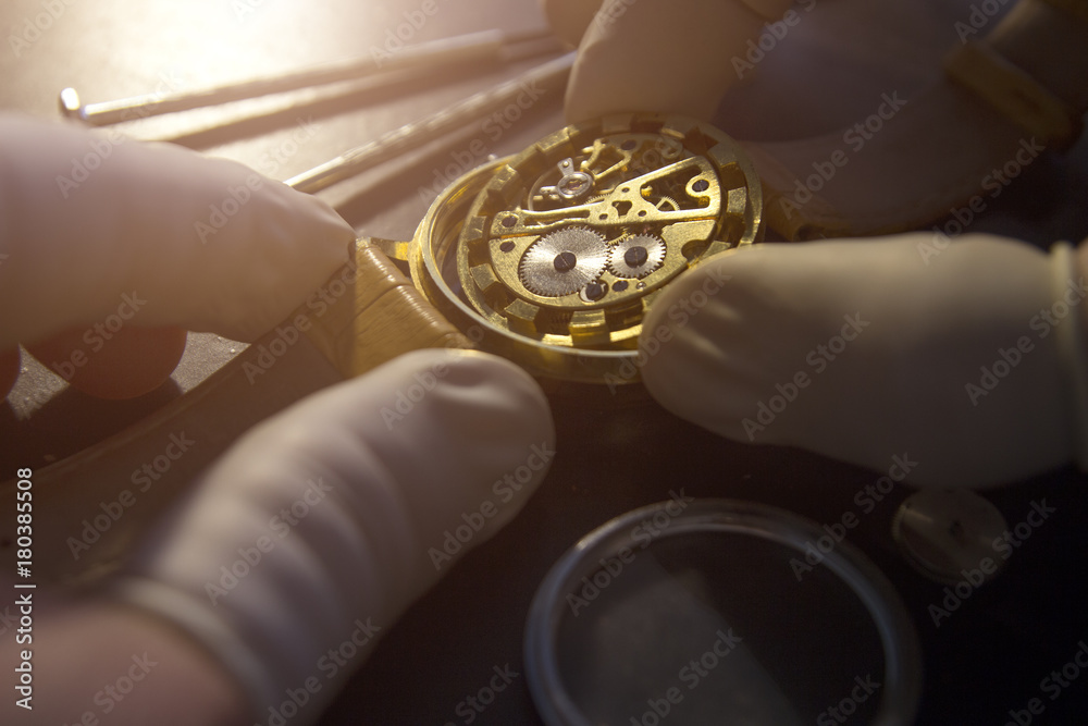 Watchmaker is repairing the mechanical watches in his workshop Watchmaker is repairing the mechanical watches in his workshop