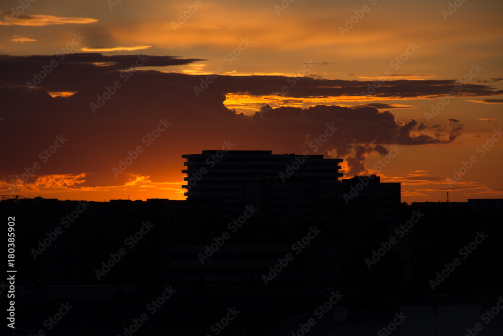 Fototapeta premium Building silhouette under dramatic sunset