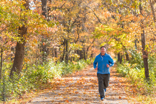Man running on autumn trail